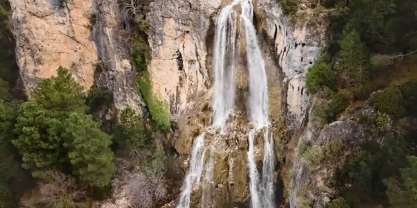 Scenic view of the Endoro Falls surrounded by lush greenery in the Ngorongoro Conservation Area