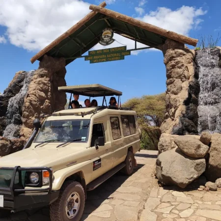 Our safari vehicle entering the entrance of Lake Manyara National Park, ready for an exciting wildlife adventure