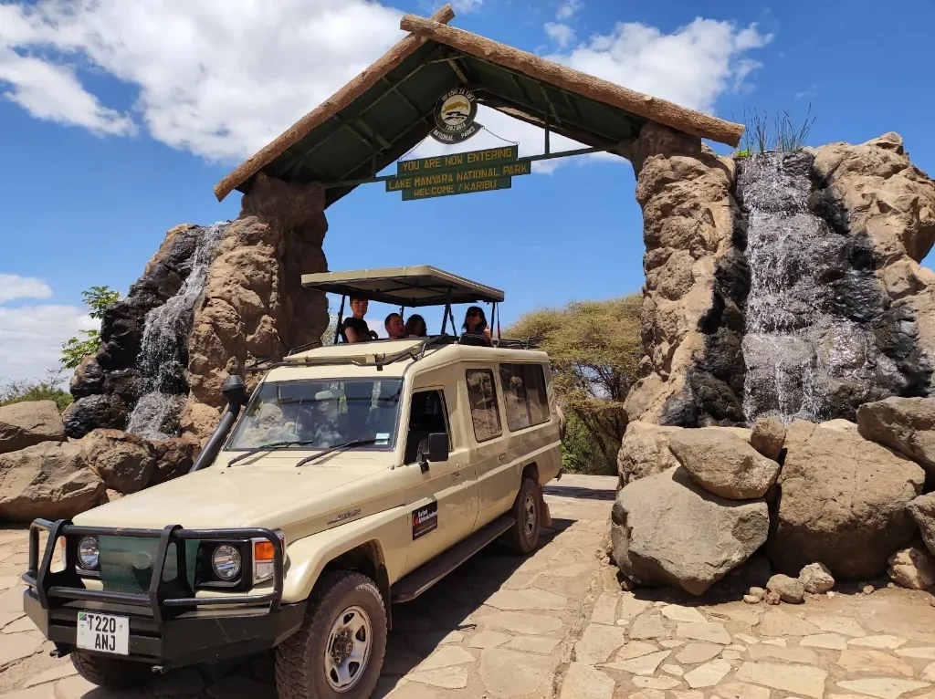 Our safari vehicle entering the entrance of Lake Manyara National Park, ready for an exciting wildlife adventure